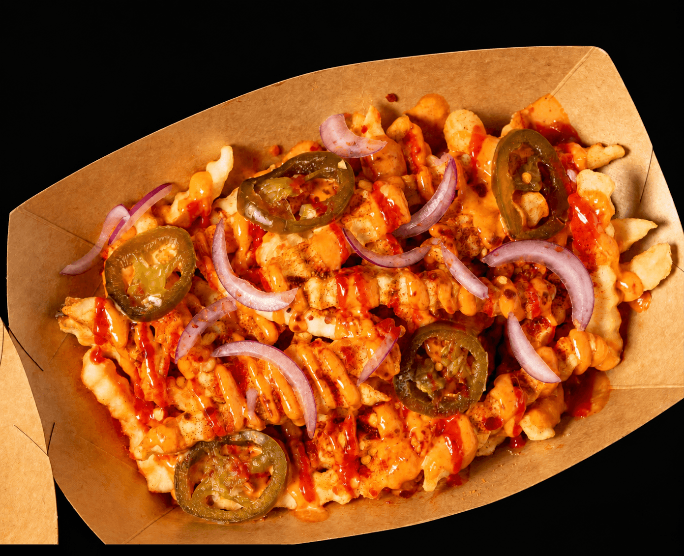 Proper Burger Firecracker Fries with jalapeños and onions.